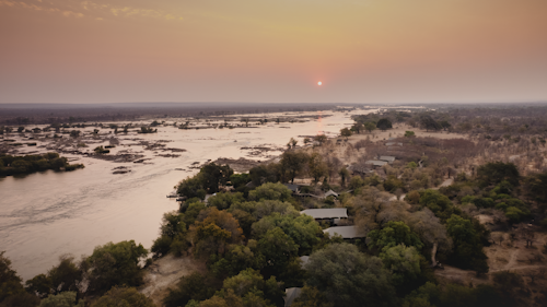 On the banks of the Zambezi River, Wilderness Toka Leya is far enough from Livingstone to ensure a tranquil, authentic bush experience, yet close enough for guests to enjoy all the many activities in the greater Victoria Falls area. Wilderness Toka Leya can be all about adrenaline, or an opportunity to relax and unwind before or after a safari. 

Wilderness Toka Leya has twelve luxurious tents (of which three are family tents). Each has a sumptuous outdoor bath, while the wellness centre with yoga and meditation options complements the serene surroundings. Boating and catch-and-release fishing excursions bring the Zambezi experience to life. 

Insider’s Tip: Reconnect with nature by enjoying a massage treatment on the banks of the Zambezi River!