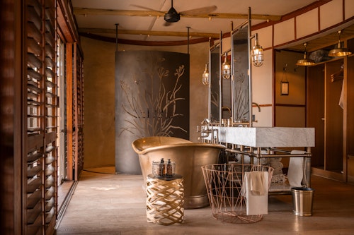 Wilderness Mombo, on Mombo Island just off the northern tip of Chief’s Island, is built under large shady trees and overlooks a wonderful floodplain teeming with wildlife. 

Accommodation comprises eight spacious suites raised off the ground, all built to maximise the vistas over the plains. Each tent is elegantly furnished, complete with en-suite bathroom, a dressing area, indoor and outdoor showers; as well as a bathtub that creates a sense of indulgence. The expanded deck includes a sala and plunge pool.

A large living and dining area looks out over that same view, while Wilderness Mombo’s famous traditional dinners are hosted in the nearby boma. Wilderness Mombo shares a Safari Boutique, spa, gym and lap pool with Wilderness Little Mombo. Large concentrations of plains game often occur in front of camp, and you may see a variety of animals without even leaving the veranda.

Insider’s Tip: Arguably the best big game viewing in all of Africa with a bountiful hunting ground for large prides of lions and leopards.
