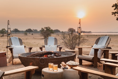 Wilderness Chikwenya overlooks a beautiful stretch of the Zambezi River in the eastern section of Mana Pools National Park, one of the most remote and beautiful areas in Zimbabwe. Views extend over open floodplains down to the legendary river and across to the mountains of the Rift Valley escarpment, while stretching inland behind Wilderness Chikwenya are the dense woodlands so characteristic of the area. The canvas tents are set on low wooden decks and linked to the raised main area by wooden walkways. 

A lounge, dining and bar area offer a sanctuary of hospitality and relaxation, while a pool deck and fire place offer alternate spaces to take in the scenery and passing wildlife. The area is renowned for its large numbers of elephant, buffalo, hippo and eland, especially in winter when they concentrate along the river – these and a variety of predators can be seen from camp.

Insider's Tip: Protein-rich albida pods attract many species, particularly elephant, during the dry season.