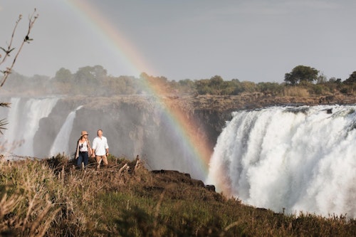 Witness the breathtaking majesty of Victoria Falls, a World Heritage Site straddling the borders of Zimbabwe and Zambia. 

As you stand before the most expansive curtain of water on Earth, experience the breathtaking "Smoke that Thunders," locally known as "Mosi-oa-Tunya."

From February to May each year, the Victoria Falls are in full flood and 500 million liters of water tumble over the edge into a series of gorges each minute! After a briefing and explanation of the Falls, your guide accompanies you along the 1.7-kilometers scenic pathways of the rainforest, stopping at numerous viewpoints to gaze at the Falls. 

This privately guided tour lasts approximately 1.5 - 2 hours.