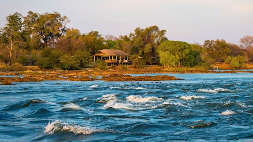 On the banks of the Zambezi River, Wilderness Toka Leya is far enough from Livingstone to ensure a tranquil, authentic bush experience, yet close enough for guests to enjoy all the many activities in the greater Victoria Falls area. Wilderness Toka Leya can be all about adrenaline, or an opportunity to relax and unwind before or after a safari. 

Wilderness Toka Leya has twelve luxurious tents (of which three are family tents). Each has a sumptuous outdoor bath, while the wellness centre with yoga and meditation options complements the serene surroundings. Boating and catch-and-release fishing excursions bring the Zambezi experience to life. 

Insider’s Tip: Reconnect with nature by enjoying a massage treatment on the banks of the Zambezi River!