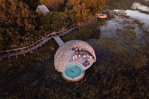 In the heart of the Okavango, luxurious Wilderness Jao is set amongst islands fringed with riverine forests and vast floodplains with prolific wildlife. Shaded by a canopy of trees, the five spacious suites and two ultra-luxe villas offer en-suite facilities with both indoor and outdoor showers. Expansive views from the private sala at each suite make for a sumptuous setting for afternoon siestas.

Customised luxury guest suites and two ultra-luxe villas share Jao Island with the spectacular main area which features a pool, a library, and an outdoor boma for evenings of traditional food, song, and dance. The views of the night skies over Wilderness Jao cement its place in the safari firmament as a star among equals. 

Insider’s Tip: Make the most of the many luxuries offered such as the beautiful star bed sleep-out or a visit to the spa to feel utterly restored. 



