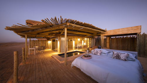 Wilderness Little Kulala is the closest luxury desert retreat to the famous, seen-from-space Sossusvlei dunes. Guests enjoy exclusive private concession access and the camp’s location makes early morning dune visits (to see Sossusvlei at its best) very easy. 

Eleven luxury desert suites expanded to offer improved airflow, each have a private plunge pool, private rooftop area for sundowners, "African tapas" and other rooftop dinners or stargazing. A signature sleep-out experience on the bottom deck of each accommodation allows for easy access during the night while there are also indoor and outdoor showers. In terms of colour and form, Wilderness Little Kulala blends seamlessly into the desert landscape with interiors reflecting the environment. Activities make the most of the solitude and stark beauty of the Namib Desert, with nature drives and guided walks revealing the majesty and mystery of the Namib Sand Sea.  

Insider's Tip: Experience the desert from new heights … a hot air balloon excursion provides awe-inspiring views of the dramatic scenery below.
