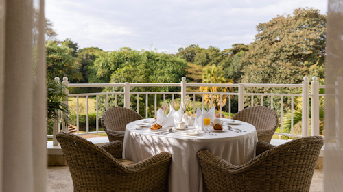 Between the rolling Ngong Hills and the vast Nairobi National Park lies Hemingways Nairobi, a boutique all-suite hotel offering a serene escape from the bustle of the city. Set in the leafy suburb of Karen, just minutes from cultural landmarks like the Karen Blixen Museum and the Giraffe Centre, it is perfectly placed for both relaxation and exploration. 

The spacious suites feature vaulted ceilings, elegant living spaces, and private terraces with sweeping views. Every detail is considered, from personalised butler service to luxury bathroom amenities, promising the highest level of comfort. During your stay, enjoy the hotel’s brasserie and bar, an indulgent spa, outdoor pool, and fitness centre, creating a retreat that feels both luxurious and personal. 

Days here can be as leisurely or adventurous as you wish. Spot wildlife on the edge of Nairobi National Park, tee off at nearby Karen Golf Club, or visit the Daphne Sheldrick Animal Orphanage to see rescued elephants up close. Evenings invite you to return for fine dining and a cocktail at sunset, framed by the hills. 

INSIDER’S TIP: Ask your butler to arrange a morning excursion into Nairobi National Park, you might spot lions hunting with the city skyline in the distance.