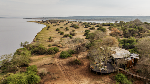 Overlooking the shimmering waters of Lake Rwanyakazinga, and the Mutumba Mountains to the west, Magashi Peninsula is situated in a private concession within Akagera National Park – Central Africa’s largest protected wetland and Rwanda’s only refuge for savannah species. This area offers exceptional game-viewing opportunities in landscapes varying from open plains and woodlands to swamps, lakes, and rolling grassy hills.
 
Wilderness Magashi Peninsula is an exclusive, eight-bed camp situated in Akagera National Park, Rwanda. With a focus on privacy, luxury, and conservation, it promises an exceptional and diverse safari experience.
 
Insider's Tip: This remarkable conservation success story owes its achievements to species reintroductions. Akagera supports a large diversity and density of wildlife. The park is home to leopard and lion, white rhinos, eastern black rhinos, buffalo, Masai giraffe, zebra, and interesting antelope such as topi, roan antelope, the elusive sitatunga, and oribi, alongside 520 bird species.