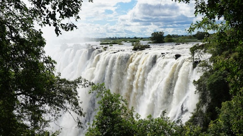 Located on the Zambian side of the water, there are a variety of luxury hotels either in Livingstone itself of alongside the Zambezi upstream. Either way, you’ll have a great base from which to fully explore this magnificent spectacle. There is plenty to do here, like tours of the falls, spotting hippos on river-based safaris, soaring over the spray on scenic helicopter flights, white water rafting in Batoka Gorge or visiting the famous Livingstone Island.

The city is becoming increasingly popular with adventure sports enthusiasts as it is with nature-lovers looking for memorable safari experiences. And the city itself offers wonderful examples of colonial architecture lining the main streets, as well as more modern African buildings.

There are many of the country’s over 750 species of birds to look out for around the town and the falls.