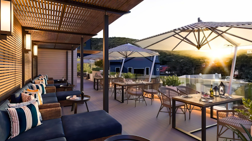 Discover the perfect balance of modern sophistication and old-world charm at The Weinberg, an urban oasis set in the vibrant heart of Namibia’s capital. Just minutes away from the city’s iconic landmarks – like Christ Church and the National Museum – the hotel is ideally positioned for both exploration and relaxation.

This boutique property offers a variety of stylish accommodations, from standard rooms to spacious two-bedroomed Terrace Suites. Each suite boasts en-suite bathrooms, air-conditioning, and private balconies. The estate also features fine dining, a luxurious day spa, and state-of-the-art business facilities.

Wind down after a day of sightseeing with a glass of local wine while taking in panoramic views of the valley. Explore Windhoek’s historical sites or indulge in activities like shopping and sampling local delicacies, all just steps from your door.

INSIDER’S TIP:  For a truly unforgettable evening, head to the terrace at sunset. With a glass of fine South African wine in hand, watch the valley light up in hues of gold and amber. Then, retreat to your suite’s private balcony for a starlit dinner, accompanied by the twinkling city lights below. 