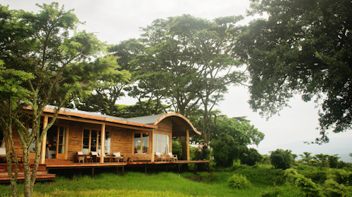 Sitting high atop the Ngorongoro Crater rim, Entamanu Ngorongoro offers a unique retreat into the heart of the Tanzanian highlands. Here, you can escape the bustle of the everyday, finding the rhythm of Maasai pastoralist life in the quiet volcanic hills here. 

There is nothing tame about this location, where the high-altitude sun and brisk winds create a unique highland environment. Entamanu Ngorongoro is a thoughtfully designed refuge above the main tourist trails of the famed crater, providing shelter within the elemental place it sits. 

Each of the property’s spacious en-suite tents is adorned with soft textiles, cosy heaters, and sumptuous sheepskin. Step onto your private balcony to take in the horizon-wide vistas of the iconic crater and ancient acacia trees, a canvas of natural splendour.

An homage to local artistry, every detail of the camp reflects the pulse of the region. Here, in the untouched wilderness, Entamanu Ngorongoro offers a unique and exciting journey beyond the tourist trail.

Insider's Tip: Don't miss the opportunity to join a guided nature walk led by local Maasai guides. It's a chance to deepen your connection with the land and its inhabitants, while gaining unique knowledge into the local ecology and culture.
