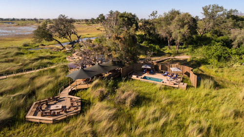 This small, intimate camp embodies all that is best about the Okavango Delta – breathtaking beauty, remote, peaceful island location, abundant game and varied landscapes. Add in the warm hospitality of the people of this region – who are stakeholders in the ecotourism success story of the Okavango – and you have a winning (and beautiful) combination.

With access to varied, game-rich habitats, this six-tented camp nestles beneath the trees of an ancient island forest. A floating jetty connects land with water, and the wildlife experience can include sightings of sable, and African wild dogs. 

Insider’s Tip: Float along a crystal-clear Okavango waterway by mokoro as you scan for reed frogs and water lilies. 


