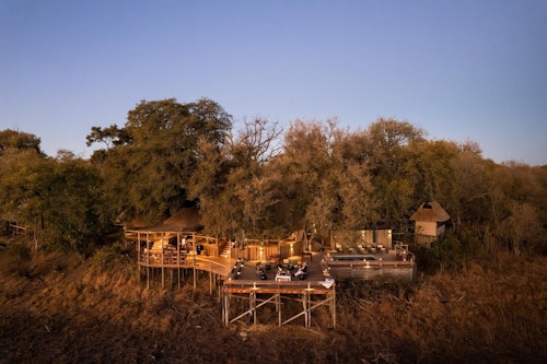 Wilderness Savuti is situated in the private Linyanti Wildlife Reserve along the Savuti Channel, famous as a sporadic and unusual watercourse. As part of a natural cycle, the waters of the Savuti either flow strongly – a magnet for thirsty wildlife – or recede to leave behind a rich grassland. 

Wilderness Savuti provides front-row seats to amazing wildlife viewing perched high on the banks of the channel. The camp looks down on a miraculous ribbon of territory where both plains game and predators thrive, and exploring the length of this channel and its associated woodlands is thus a highlight here. 

The intimate camp's en-suite accommodation is in six canvas-and-thatch tents (including a family unit). From the camp's thatched dining area, elevated wooden decks extend out over the channel bed, with a small pool, fire deck and wonderful views over the channel.

Insider’s Tip: The Savuti Star Bed with a sublime location overlooking the Savuti Channel and facing Zibadianja Lagoon to the west. Intimate encounters with iconic wildlife parading in the channel, as the Milky Way dances across an inky African sky. It is the perfect spot to end a magical day on safari, as the calls of the wild soothe you to sleep.
