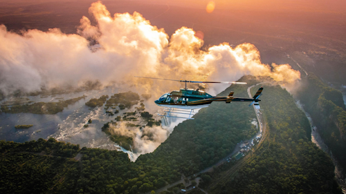 Take to the skies on an unforgettable 13-minute helicopter flight over the awe-inspiring Victoria Falls, the world's largest sheet of falling water. This unique perspective, famously dubbed the "Flight of the Angels" by David Livingstone, offers breathtaking views of the cascading waters and their immense power.

From your aerial vantage point, marvel at the grandeur of the falls as the helicopter manoeuvres left and right for perfect views. The adventure continues upriver along the Zambezi and concludes with a stunning flyover of the Zambezi National Park.

Elevate your experience and witness nature's masterpiece from a perspective like no other!