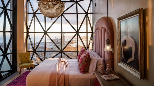 The Silo is a magical space towering above the V&A Waterfront. The Silo is built in the grain elevator portion of the historic grain silo complex occupying six floors above the Zeitz Museum of Contemporary Art Africa (MOCAA). The hotel has 28 rooms, including a spectacular penthouse. Each room is individually designed and decorated by the stylish Liz Biden. Colourful and eclectic pieces juxtapose the modern, industrial architecture. The seven room categories are based on the room size and the views. The rooms are more spacious vertically than horizontally due to the unique architecture of The Silo and in particular the ingenious design of the pillowed window bays which are one of the key architectural features. 

INSIDER'S TIP: Zeitz MOCAA is a contemporary art museum that rivals the likes of the Tate Modern in London, MoMA in New York and Museo Nacional del Prado in Madrid.