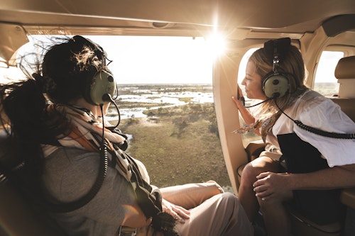 Take to the skies on a breathtaking 60-minute helicopter tour over the Okavango Delta, where the wild unfolds beneath you in a stunning tapestry of life and color. This exhilarating flight offers unmatched aerial views, revealing the Delta's raw beauty from soaring heights and close-up angles alike.

Hovering up to 1,000 feet before swooping down for intimate glimpses, you'll see the Delta's intricate channels, lush floodplains, and diverse wildlife. The open-door design ensures panoramic vistas and unobstructed photographyperfect for capturing elusive wildlife and remote landscapes. Expert pilots guide you to prime spots, sharing insights into this ecological marvel.

Whether youre a nature lover or avid photographer, the Delta's golden light during dawn or dusk offers unforgettable scenes. Capture the beauty of Botswana like never beforethis is the ultimate way to witness the Okavango in all its glory.